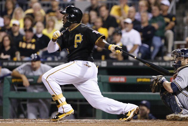 Pittsburgh Pirates' Josh Harrison (5) drives in a run with a single off Milwaukee Brewers starting pitcher Matt Garza during the fifth inning of a baseball game in Pittsburgh Saturday, Sept. 20, 2014. (AP Photo/Gene J. Puskar)