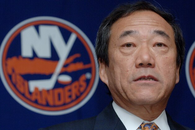 FILE - In this Jan. 12, 2006, file photo, New York Islanders' owner Charles Wang speaks during a news conference in Uniondale, New York. The Islanders have announced that the team is being sold to a former Washington Capitals co-owner and a London-based investor. In a statement Tuesday, Aug. 19, 2014, the team says a group led by former Capitals co-owner Jon Ledecky and investor Scott Malkin has reached an agreement to buy a