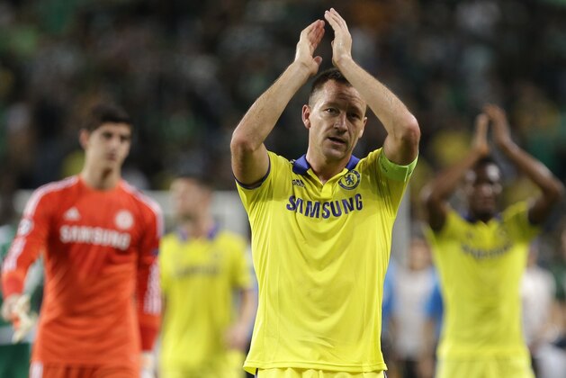 Chelsea's John Terry celebrates his side's 1-0 win at the end of a Champions League, Group G soccer match between Sporting and Chelsea, in Lisbon, Tuesday, Sept. 30, 2014. (AP Photo/Francisco Seco)