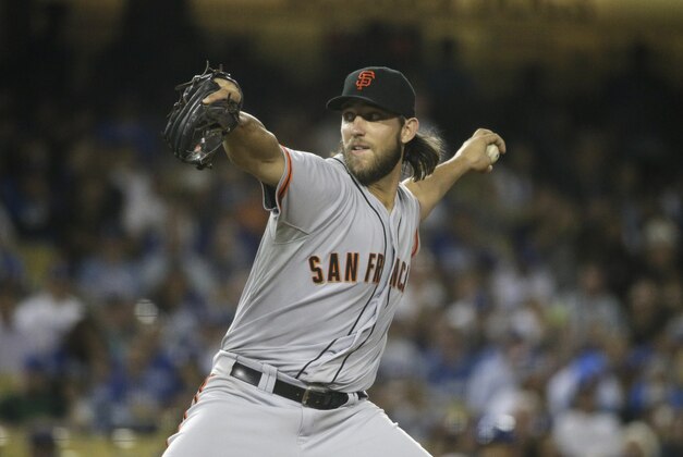 San Francisco Giants starting pitcher Madison Bumgarner throws against the Los Angeles Dodgers during the seventh inning of a baseball game Tuesday, Sept. 23, 2014, in Los Angeles. (AP Photo/Jae C. Hong)
