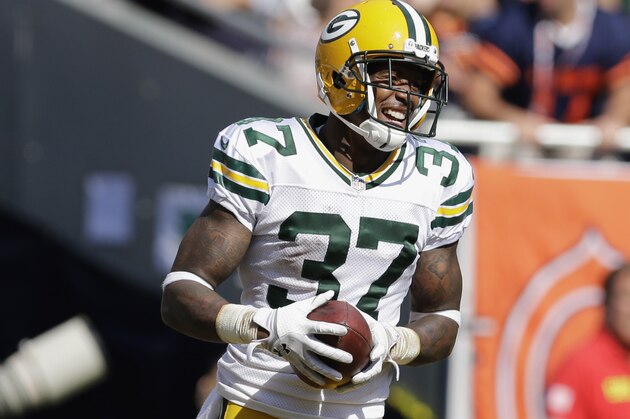 Green Bay Packers cornerback Sam Shields (37) reacts after intercepting a pass thrown by Chicago Bears quarterback Jay Cutler (6) in the second half of an NFL football game Sunday, Sept. 28, 2014, in Chicago. (AP Photo/Nam Y. Huh)