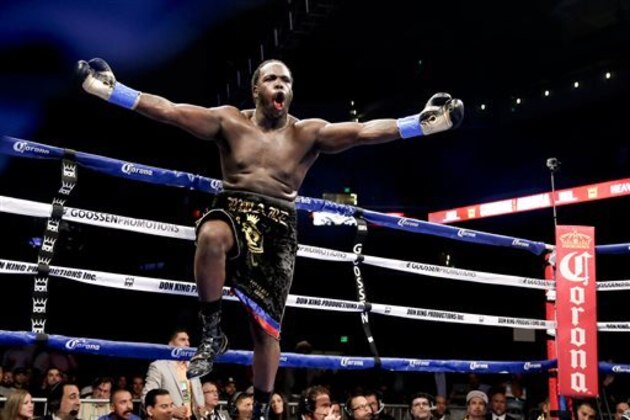 Bermane Stiverne celebrates after referee Jack Reiss stopped his fight against Chris Arreola during their rematch for the WBC heavyweight boxing title in Los Angeles, Saturday, May 10, 2014. Stiverne won the title. (AP Photo/Chris Carlson)