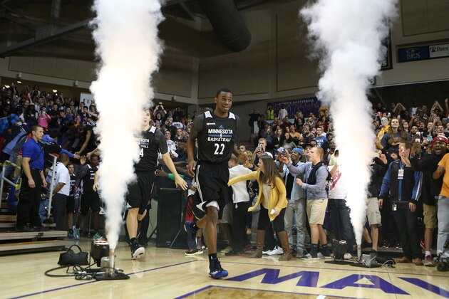 MANKATO, MN - SEPTEMBER 29: Andrew Wiggins #22 of the Minnesota Timberwolves enters the court for 2014 Training Camp opening event Dunks after Dark starting at midnight on September 29, 2014 at the Bresnan Arena Taylor Center on the campus of Minnesota State University, Mankato in Mankato, Minnesota. NOTE TO USER: User expressly acknowledges and agrees that, by downloading and or using this Photograph, user is consenting to the terms and conditions of the Getty Images License Agreement. Mandatory Copyright Notice: Copyright 2014 NBAE (Photo by David Sherman/NBAE via Getty Images) MANKATO, MN - SEPTEMBER 29: Andrew Wiggins #22 of the Minnesota Timberwolves enters the court for 2014 Training Camp opening event Dunks after Dark starting at midnight on September 29, 2014 at the Bresnan Arena Taylor Center on the campus of Minnesota State University, Mankato in Mankato, Minnesota. NOTE TO USER: User expressly acknowledges and agrees that, by downloading and or using this Photograph, user is consenting to the terms and conditions of the Getty Images License Agreement. Mandatory Copyright Notice: Copyright 2014 NBAE (Photo by David Sherman/NBAE via Getty Images)