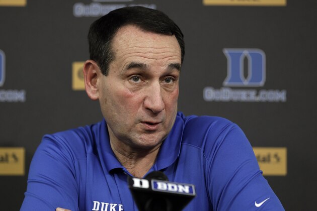 Duke basketball coach Mike Krzyzewski reacts while speaking to members of the media during a press conference in Durham, N.C., Thursday, Sept. 18, 2014. (AP Photo/Gerry Broome)