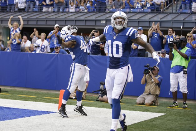 Indianapolis Colts running back Ahmad Bradshaw celebrates a touchdown during the second half of an NFL football game against the Tennessee Titans with wide receiver Donte Moncrief in Indianapolis, Sunday, Sept. 28, 2014. (AP Photo/Darron Cummings)