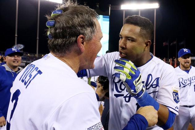 KANSAS CITY, MO - SEPTEMBER 30:  Manager Ned Yost #3 celebrates with Salvador Perez #13 of the Kansas City Royals after they defeated the Oakland Athletics 9 to 8 in the 12th inning of their American League Wild Card game at Kauffman Stadium on September 30, 2014 in Kansas City, Missouri.  (Photo by Ed Zurga/Getty Images)