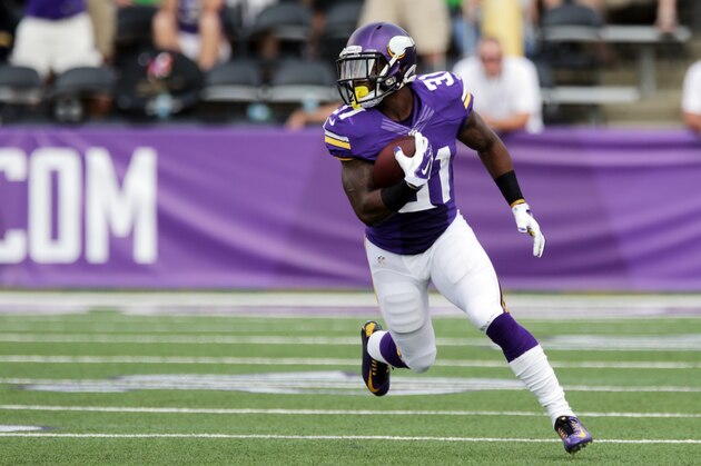 Minnesota Vikings running back Jerick McKinnon runs for extra yardage during the first half of an NFL football game against the Atlanta Falcons, Sunday, Sept. 28, 2014, in Minneapolis. (AP Photo/Jim Mone)