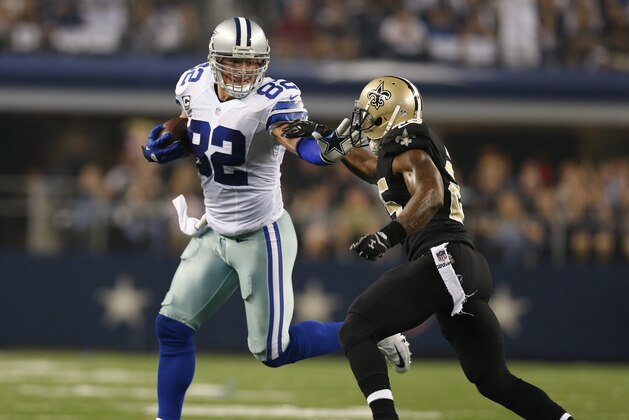 Sep 28, 2014; Arlington, TX, USA; Dallas Cowboys tight end Jason Witten (82) runs after a reception in the fourth quarter against New Orleans Saints safety Rafael Bush (25) at AT&T Stadium. The Cowboys beat the Saints 38-17. Mandatory Credit: Matthew Emmons-USA TODAY Sports