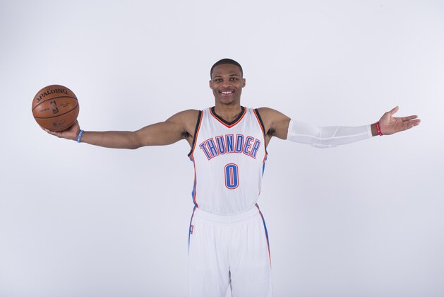 Oklahoma City, OK - SEPTEMBER 29: Russell Westbrook #0 of the Oklahoma City Thunder poses for a portrait during 2014 NBA Media Day on September 27, 2014 at the Chesapeake Arena in Oklahoma City, Oklahoma. NOTE TO USER:  User expressly acknowledges and agrees that, by downloading and/or using this photograph, user is consenting to the terms and conditions of the Getty Images License Agreement. Mandatory Copyright Notice:  Copyright 2014 NBAE (Photo by Richard Rowe/NBAE via Getty Images)