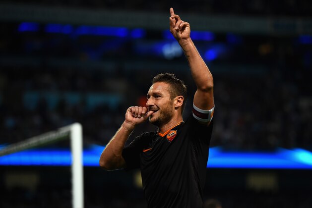 MANCHESTER, ENGLAND - SEPTEMBER 30:  Francesco Totti of AS Roma celebrates scoring his team's first goal during the UEFA Champions League Group E match between Manchester City FC and AS Roma  on September 30, 2014 in Manchester, United Kingdom.  (Photo by Laurence Griffiths/Getty Images)