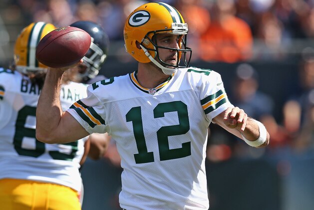 CHICAGO, IL - SEPTEMBER 28:  Aaron Rodgers #12 of the Green Bay Packers passes against the Chicago Bears at Soldier Field on September 28, 2014 in Chicago, Illinois. The Packers defeated the Bears 38-17.  (Photo by Jonathan Daniel/Getty Images)