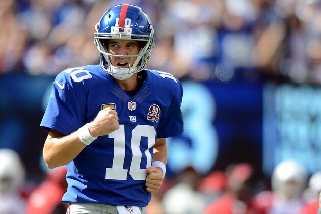 EAST RUTHERFORD, NJ - SEPTEMBER 14:  Quarterback Eli Manning #10 of the New York Giants celebrates a third quarter touchdown against the Arizona Cardinals during a game at MetLife Stadium on September 14, 2014 in East Rutherford, New Jersey.  (Photo by Ron Antonelli/Getty Images)