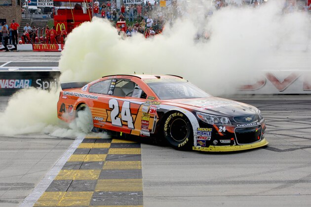 DOVER, DE - SEPTEMBER 28:  Jeff Gordon, driver of the #24 Drive To End Hunger Chevrolet, celebrates with a burnout after winning the NASCAR Sprint Cup Series AAA 400 at Dover International Speedway on September 28, 2014 in Dover, Delaware.  (Photo by Brian Lawdermilk/Getty Images)