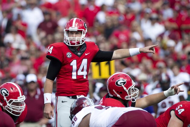 Georgia quarterback Hutson Mason (14) sets the offense in the first half of an NCAA college football game against Troy Saturday, Sept. 20, 2014, in Athens, Ga. (AP Photo/John Bazemore)