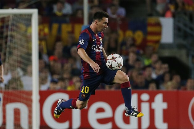 Barcelona's Lionel Messi controls the ball during the Champions League Group F soccer match between Barcelona and Apoel at the Camp Nou stadium in Barcelona, Spain, Wednesday, Sept. 17, 2014. (AP Photo/Emilio Morenatti)
