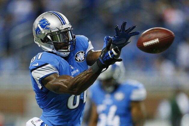 Detroit Lions wide receiver Calvin Johnson makes a catch during warm-ups before an NFL football game against Green Bay in Detroit, Sunday, Sept. 21, 2014. (AP Photo/Rick Osentoski)