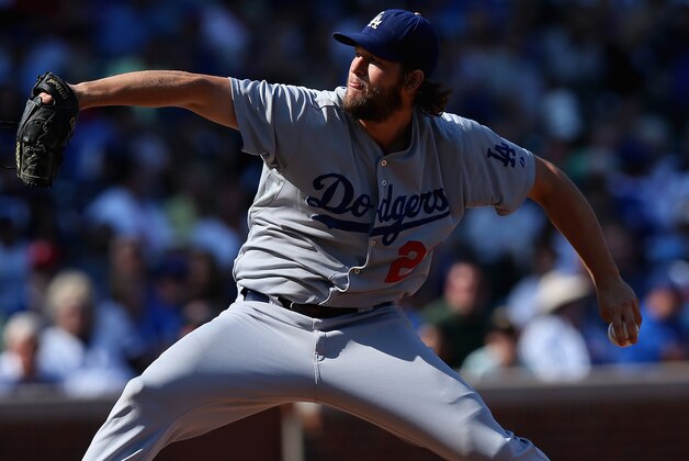 CHICAGO, IL - SEPTEMBER 19:  Starting pitcher Clayton Kershaw #22 of the Los Angeles Dodgers delivers the ball against the Chicago Cubs at Wrigley Field on September 19, 2014 in Chicago, Illinois. The Dodgers defeated the Cubs 14-5.  (Photo by Jonathan Daniel/Getty Images)