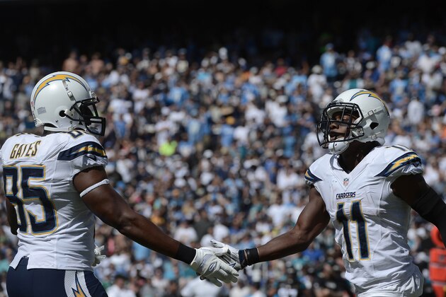 SAN DIEGO - SEPTEMBER 28:  Eddie Royal #11 of the San Diego Chargers is congratulated by teammate Antonio Gates after Royals touchdown during his team's 33-14 win over the Jacksonville Jaguars  in their NFL game at Qualcomm Stadium on September 28, 2014 in San Diego, California. (Photo by Donald Miralle/Getty Images)