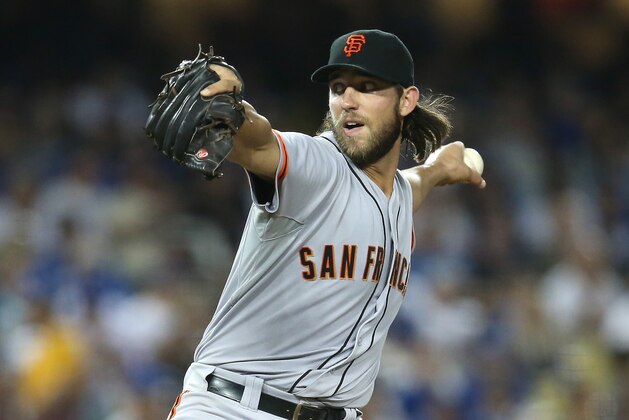 LOS ANGELES, CA - SEPTEMBER 23: Madison Bumgarner #40 of the San Francisco Giants throws a pitch against the Los Angeles Dodgers at Dodger Stadium on September 23, 2014 in Los Angeles, California. (Photo by Stephen Dunn/Getty Images) LOS ANGELES, CA - SEPTEMBER 23: Madison Bumgarner #40 of the San Francisco Giants throws a pitch against the Los Angeles Dodgers at Dodger Stadium on September 23, 2014 in Los Angeles, California. (Photo by Stephen Dunn/Getty Images)