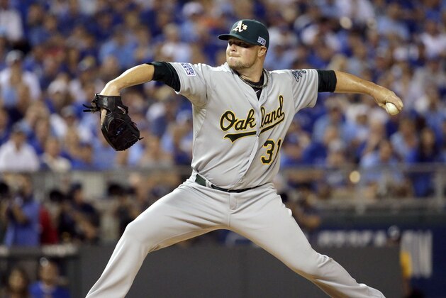 Oakland Athletics starting pitcher Jon Lester throws during the first inning of the AL wild-card playoff baseball game against the Kansas City Royals Tuesday, Sept. 30, 2014, in Kansas City, Mo. (AP Photo/Charlie Riedel)