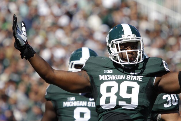 Michigan State's Shilique Calhoun celebrates his sack against Wyoming during the first quarter of an NCAA college football game, Saturday, Sept. 27, 2014, in East Lansing, Mich. Michigan State won 56-14. (AP Photo/Al Goldis)