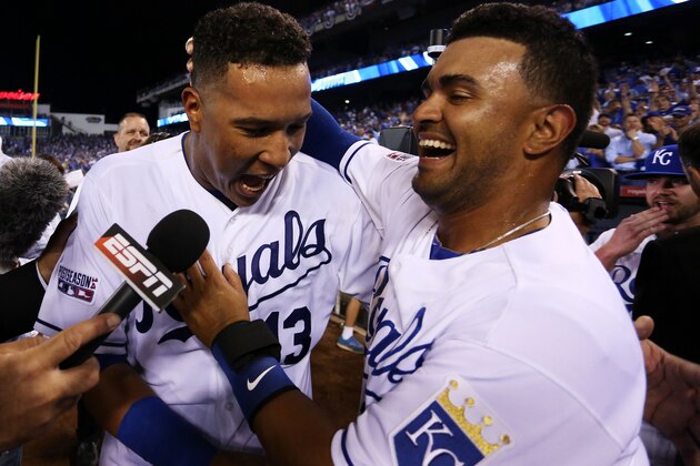KANSAS CITY, MO - SEPTEMBER 30:  Salvador Perez #13 of the Kansas City Royals celebrates with teammates after they defeated the Oakland Athletics 9 to 8 in the 12th inning of their American League Wild Card game at Kauffman Stadium on September 30, 2014 in Kansas City, Missouri.  (Photo by Ed Zurga/Getty Images)