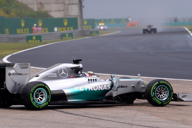 BUDAPEST, HUNGARY - JULY 27:  Lewis Hamilton of Great Britain and Mercedes GP rejoins the race after spinning off at turn two during the Hungarian Formula One Grand Prix at Hungaroring on July 27, 2014 in Budapest, Hungary.  (Photo by Lars Baron/Getty Images)