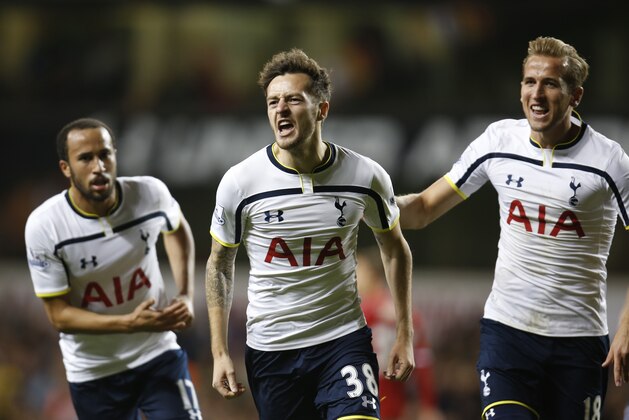 Tottenham Hotspur's Ryan Mason, centre, celebrates his goal against Nottingham Forest during an English League Cup soccer match at the White Hart Lane ground, in London, Wednesday, Sept. 24, 2014. (AP Photo/Lefteris Pitarakis)