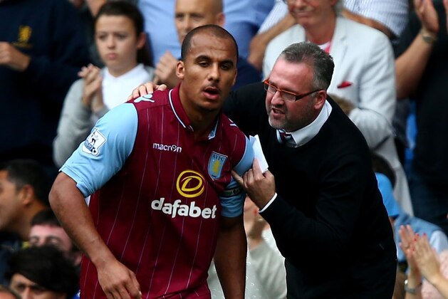 LONDON, ENGLAND - SEPTEMBER 27:  Manager Paul Lambert of Aston Villa speaks with Gabriel Agbonlahor of Aston Villa during the Barclays Premier League match between Chelsea and Aston Villa at Stamford Bridge on September 27, 2014 in London, England.  (Photo by Clive Rose/Getty Images)