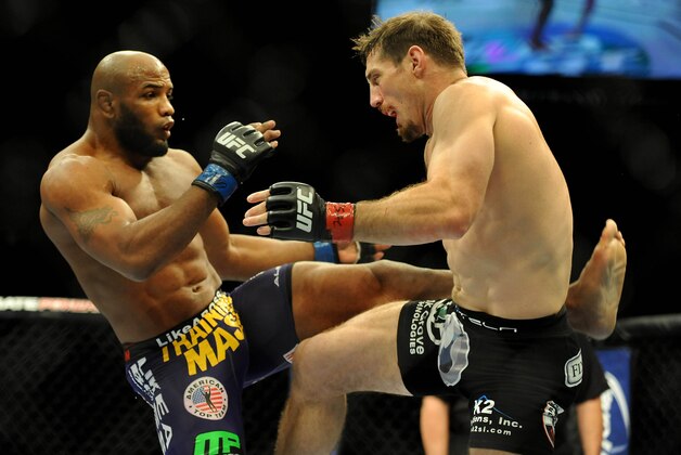 Sep 27, 2014; Las Vegas, NV, USA; Yoel Romero (blue gloves) fights Tim Kennedy (red gloves) during a middleweight fight during UFC 178 at MGM Grand Garden Arena. Mandatory Credit: Stephen R. Sylvanie-USA TODAY Sports