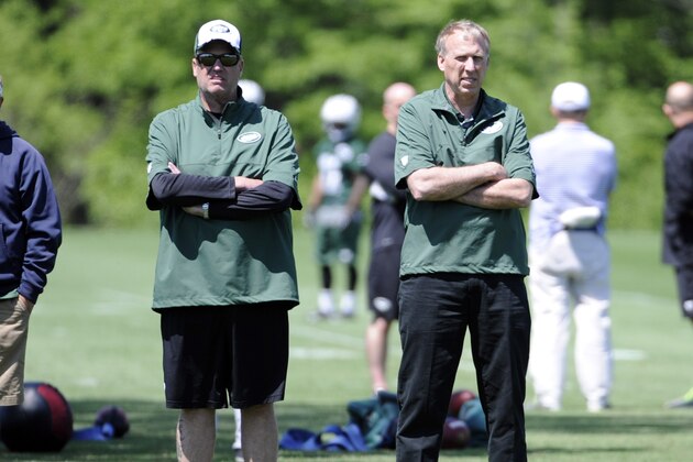 New York Jets coach Rex Ryan, left, and general manager John Idzik look on at the team's NFL football training camp Saturday, May 17, 2014, in Florham Park, N.J.  (AP Photo/Bill Kostroun)