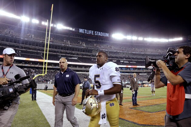 Notre Dame quarterback Everett Golson (5) leaves the field after an NCAA college football game against Syracuse, Saturday, Sept. 27, 2014, in East Rutherford, N.J. Notre Dame won 31-15. (AP Photo/Julio Cortez)