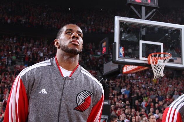 PORTLAND, OR - APRIL 27: LaMarcus Aldridge #12 of the Portland Trail Blazers stands on the court for the National Anthem before a game against the Houston Rockets in Game Four of the Western Conference Quarterfinals during the 2014 NBA Playoffs on April 27, 2014 at the Moda Center in Portland, Oregon. NOTE TO USER: User expressly acknowledges and agrees that, by downloading and or using this photograph, User is consenting to the terms and conditions of the Getty Images License Agreement. Mandatory Copyright Notice: Copyright 2014 NBAE (Photo by Sam Forencich/NBAE via Getty Images)