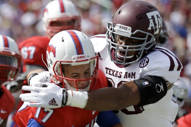 SMU quarterback Kolney Cassel (17) is sacked by Texas A&M linebacker Shaan Washington (33) in the first half of an NCAA college football game, Saturday, Sept. 20, 2014, in Dallas. (AP Photo/Tony Gutierrez)