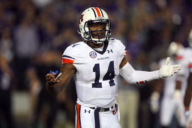 Sep 18, 2014; Manhattan, KS, USA; Auburn Tigers quarterback Nick Marshall (14) looks to the sideline for a call during a 20-14 win against the Kansas State Wildcats at Bill Snyder Family Stadium. Mandatory Credit: Scott Sewell-USA TODAY Sports
