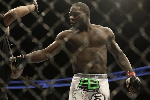 Anthony Johnson is pushed away by referee Herb Dean after beating Antonio Rogerio Nogueira by technical knockout during a light heavyweight mixed martial arts bout at a UFC on Fox event in San Jose, Calif., Saturday, July 26, 2014. Johnson won by technical knockout. (AP Photo/Jeff Chiu)