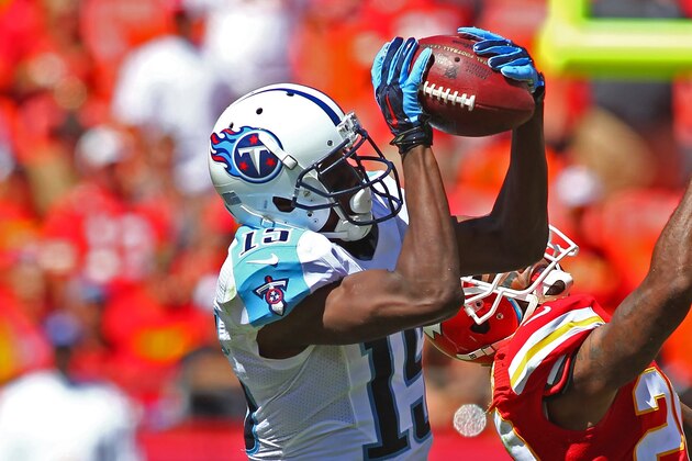 Tennessee Titans Justin Hunter (15) catches a pass over Kansas City Chiefs Chris Owens (20) during an NFL game on Sunday Sept. 7, 2014 at Arrowhead Stadium in Kansas City, MO. (AP Photo/TUSP, Jay Biggerstaff)