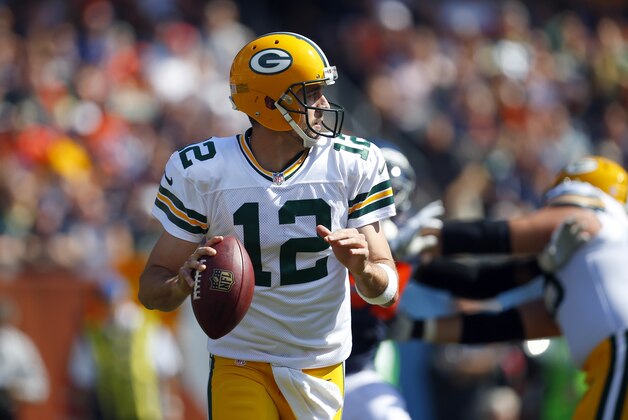 Green Bay Packers quarterback Aaron Rodgers (12) looks to pass against the Chicago Bears during an NFL game at Soldier Field in Chicago on Sunday, Sept. 28, 2014. (Jeff Haynes/AP Images for Panini)