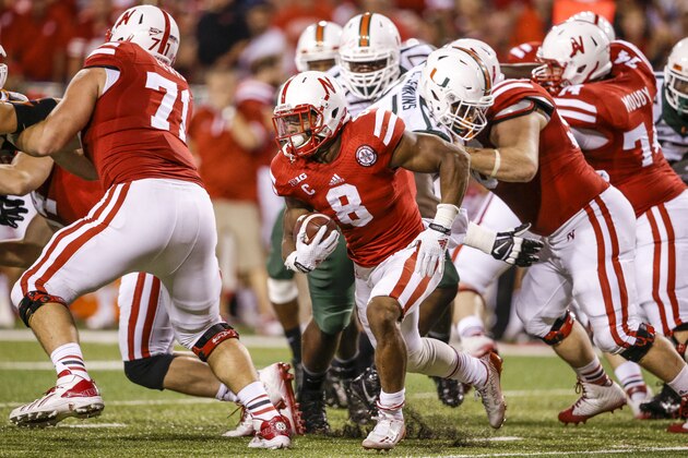 Nebraska running back Ameer Abdullah (8) carries the ball in the second half of an NCAA college football game against Miami in Lincoln, Neb., Saturday, Sept. 20, 2014. Nebraska won 41-31. (AP Photo/Nati Harnik)
