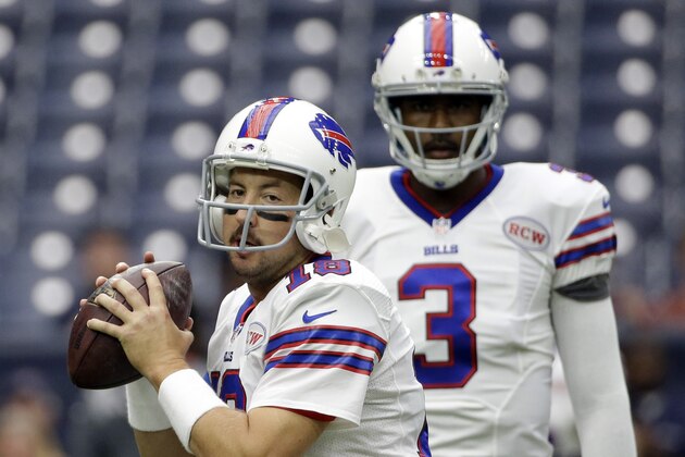 Buffalo Bills' Kyle Orton (18) throws as EJ Manuel (3) looks on prior to an NFL football game against the Houston, Sunday, Sept. 28, 2014, in Houston. (AP Photo/David J. Phillip)