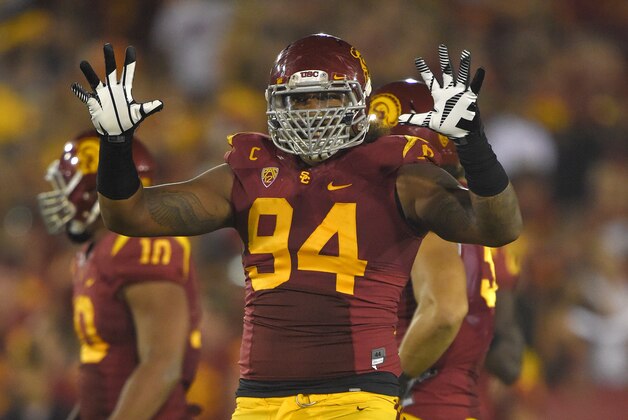 Southern California defensive end Leonard Williams gestures to the crowd during the second half of an NCAA college football game against Oregon State, Saturday, Sept. 27, 2014, in Los Angeles.  USC won the game 35-10. (AP Photo/Mark J. Terrill)