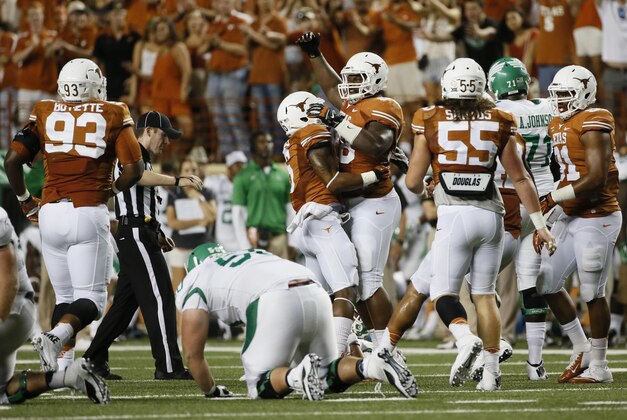 Aug 30, 2014; Austin, TX, USA; Texas Longhorns defensive tackle Hassan Ridgeway (98) celebrates after making a sack against the North Texas Mean Green during the second half at Darrell K Royal-Texas Memorial Stadium. Texas won 38-7. Mandatory Credit: Soobum Im-USA TODAY Sports