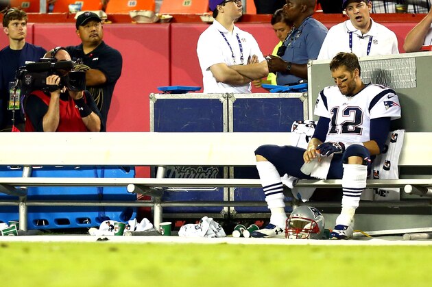 KANSAS CITY, MO - SEPTEMBER 29:   Tom Brady #12 of the New England Patriots sits on the sidelines late in the fourth quarter during the game against the Kansas City Chiefs at Arrowhead Stadium on September 29, 2014 in Kansas City, Missouri.  (Photo by Dilip Vishwanat/Getty Images)