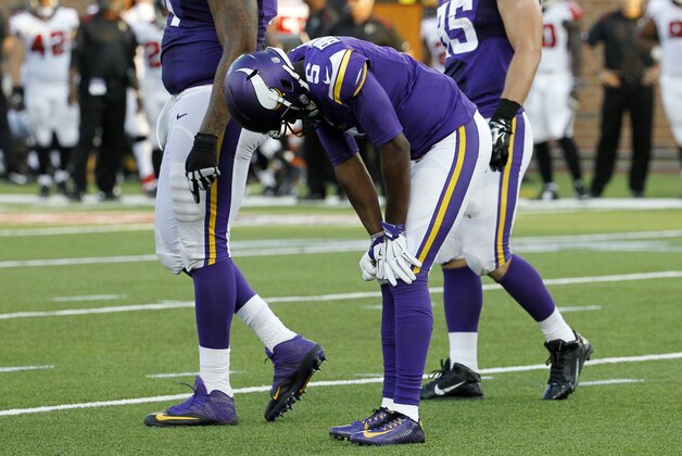 FILE - In this Sunday, Sept. 28, 2014, file photo, Minnesota Vikings quarterback Teddy Bridgewater (5) reacts after getting injured during the second half of an NFL football game against the Atlanta Falcons in Minneapolis. Bridgewater's first start for the Minnesota Vikings couldn't have been better, except of course for the sprained left ankle in the fourth quarter that forced him out of the 41-28 victory over Atlanta.(AP Photo/Ann Heisenfelt, File)