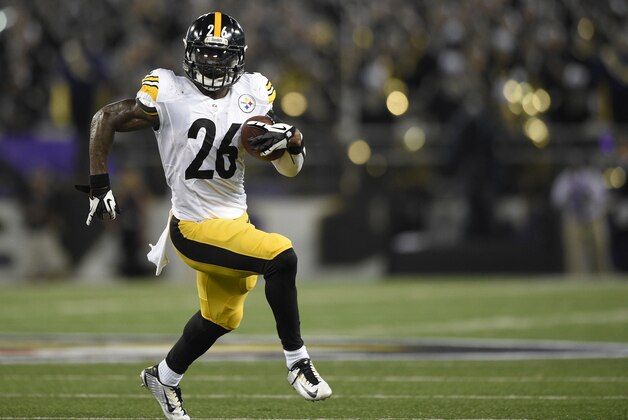 Pittsburgh Steelers running back Le'Veon Bell (26) runs with the ball against the Baltimore Ravens during the first half of an NFL football game Thursday, Sept. 11, 2014, in Baltimore. (AP Photo/Nick Wass)