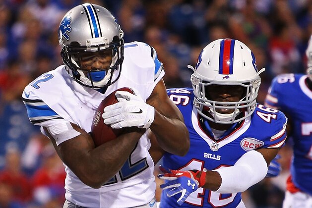 ORCHARD PARK, NY - AUGUST 28:  Jeremy Ross #12 of the Detroit Lions makes a touchdown reception as Deon Broomfield #46 of the Buffalo Bills defends during the first half of a preseason game at Ralph Wilson Stadium on August 28, 2014 in Orchard Park, New York.  (Photo by Vaughn Ridley/Getty Images)