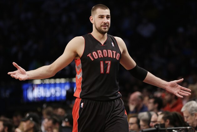 Toronto Raptors' Jonas Valanciunas reacts to a call during the first half of Game 3 of an NBA basketball first-round playoff series against the Brooklyn Nets on Friday, April 25, 2014, in New York. (AP Photo/Frank Franklin II)