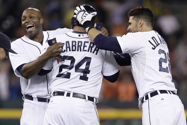 DETROIT, MI - SEPTEMBER 23:  Torii Hunter #48 of the Detroit Tigers and J.D. Martinez #28 surround Miguel Cabrera #24 after he hit a RBI-single in the ninth inning to defeat the Chicago White Sox 4-3 at Comerica Park on September 23, 2014, in Detroit, Michigan. (Photo by Duane Burleson/Getty Images)