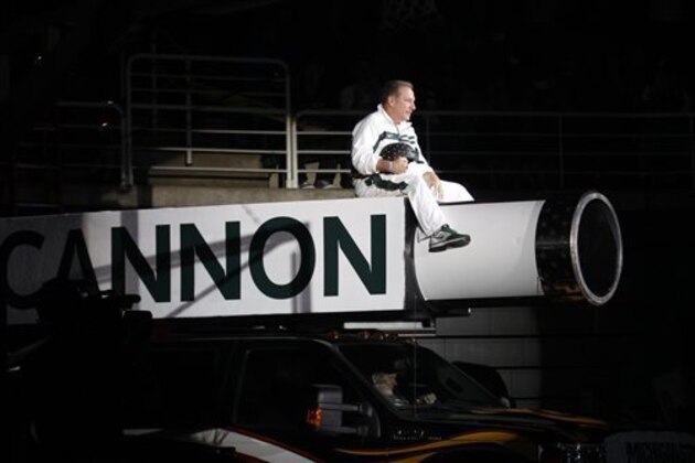 Michigan State coach Tom Izzo makes his entrance on top of a cannon before an NCAA college basketball scrimmage, Friday, Oct. 18, 2013, in East Lansing, Mich. (AP Photo/Al Goldis)