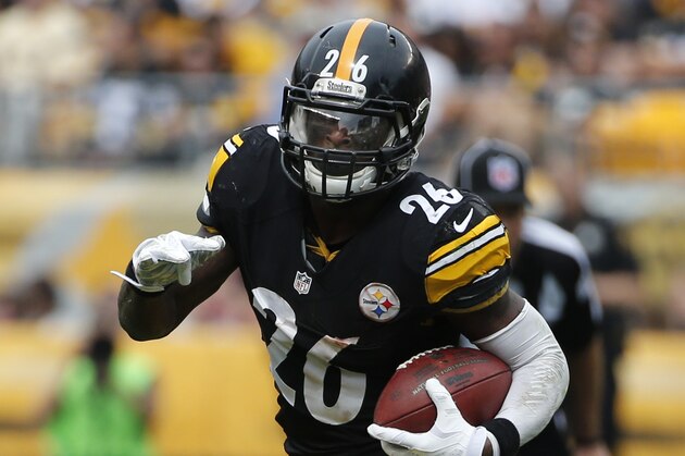 Pittsburgh Steelers running back Le'Veon Bell runs around end during the first half of an NFL football game against the Tampa Bay Buccaneers on Sunday, Sept. 28, 2014 in Pittsburgh. (AP Photo/Gene J. Puskar)